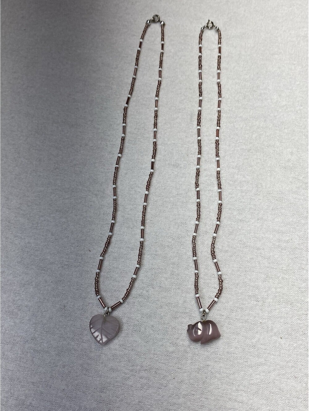 2 Handmade Beaded Necklaces with Carved Rose Quartz Leaf and Rhino Pendants